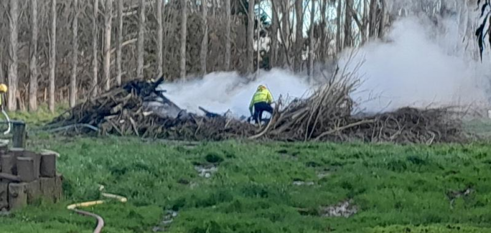 Lincoln firefighters had to put out two burn piles on Ellesmere Rd. PHOTO: LINCOLN VOLUNTEER FIRE...