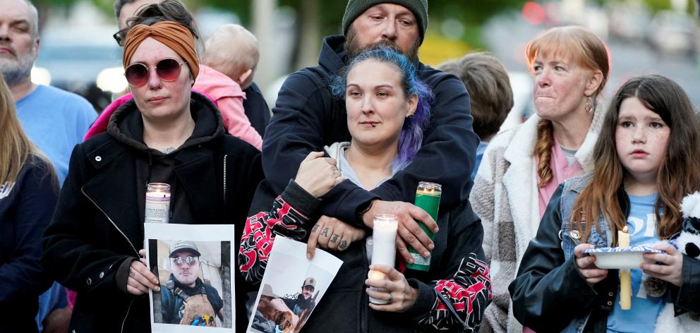 Families of people working at the pulp and paper mill attended a vigil. Photo: Reuters 
