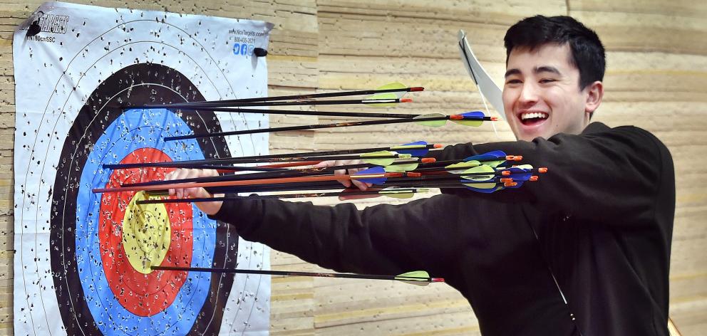 Otago University Archery Club president Charlie Boocock-Yee removes arrows from the club’s new...