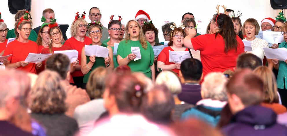 The Dunedin Rock Choir sings to a large audience at its pre-Christmas concert last year, under...