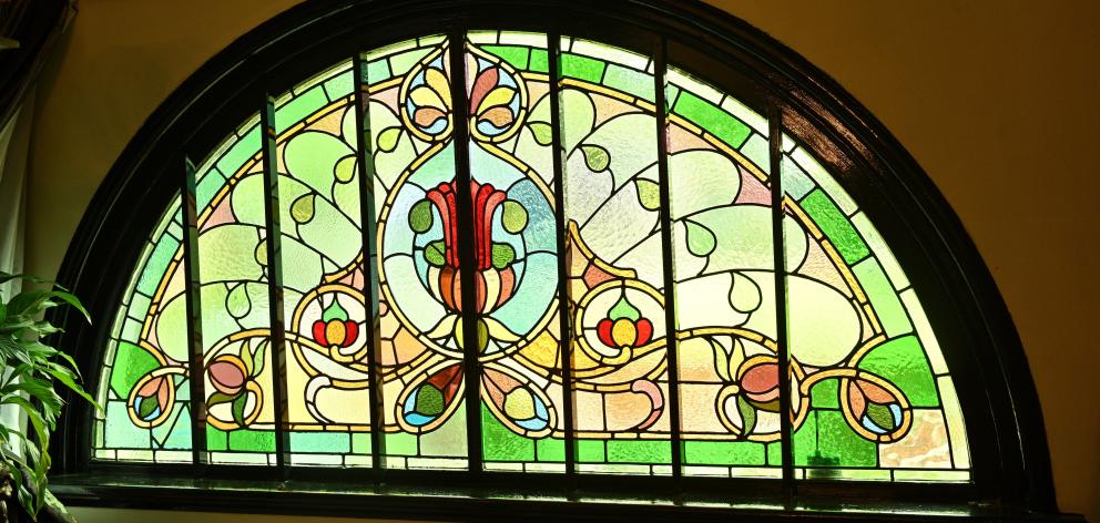 The stained glass window just inside the front door makes a grand first impression.