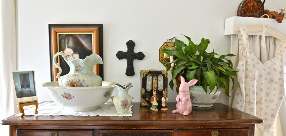 Paintings, ceramics and potted plants bring character and life to the rooms.