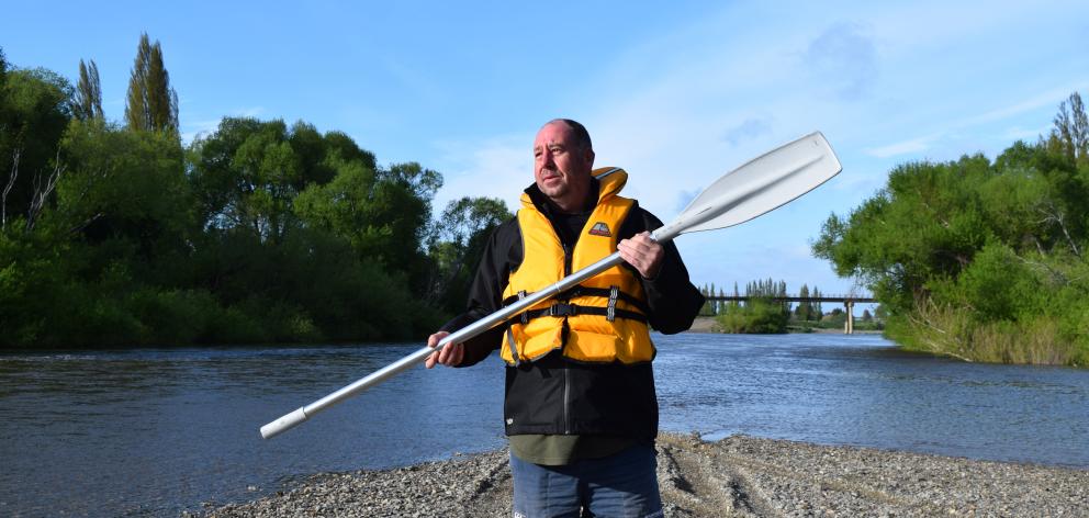 Outram raft race organiser Carl Gardner at the Taieri River. PHOTO: SHAWN MCAVINUE

