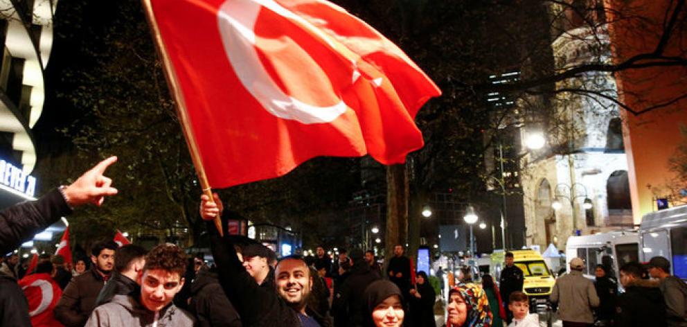People of the Turkish community living in Germany celebrate the outcome of Turkey's referendum on the constitution. Photo: Reuters