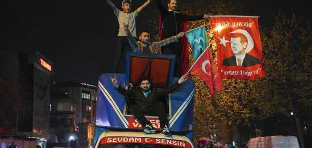 Supporters of Turkish President Tayyip Erdogan celebrate in Istanbul. Photo: Reuters Supporters of Turkish President Tayyip Erdogan celebrate in Istanbul. Photo: Reuters