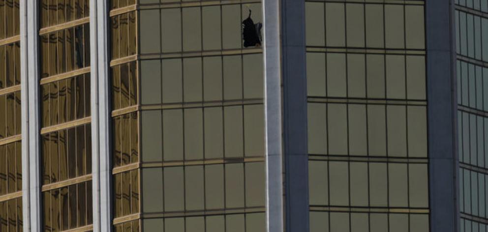 A broken window is seen at The Mandalay Bay Resort and Casino. Photo: Reuters