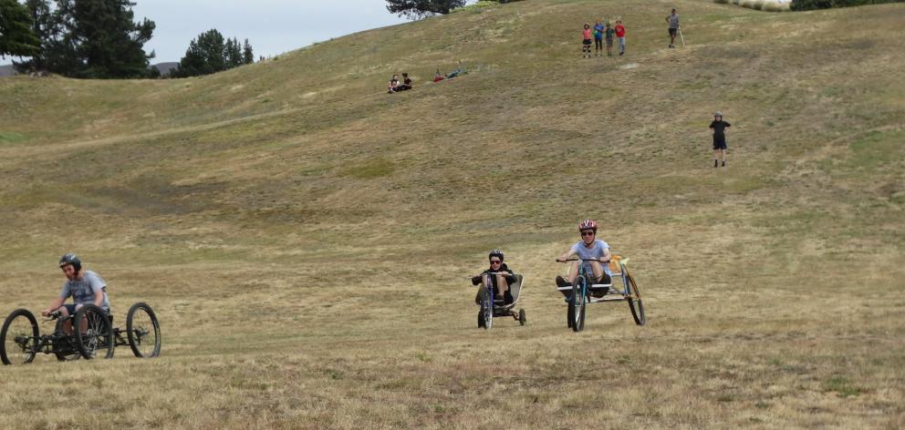 James Hey and Michael Hey (17), of Wanaka, race each other in a  go-kart derby down a hill near...