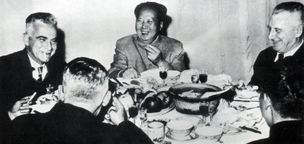 At a birthday banquet for Mao Zedong (centre) are Rewi Alley (left) and Edgar Snow (right). Photo...