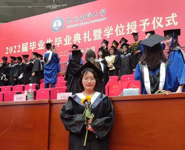 Yu Yanqia, a graduate from Kunming Medical University in southwest China’s Yunnan Province, poses...
