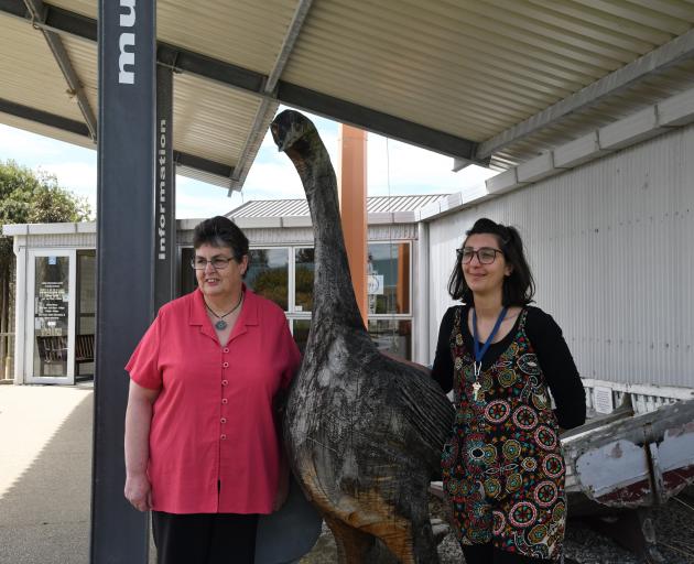 Owaka Museum director Massimiliana (Massi) Urbano and volunteer Karen Kinley with a moa statue at...