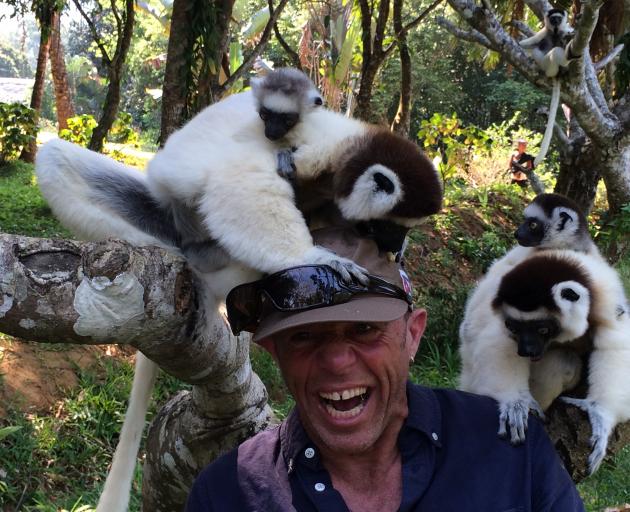 Mark Thomas in Madagascar with the lemurs.
