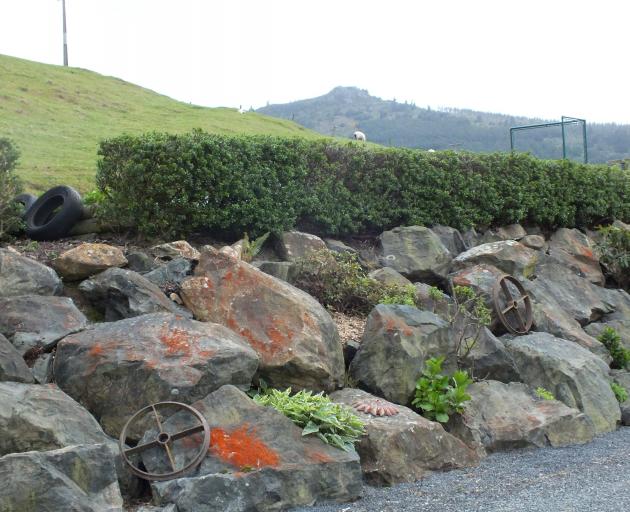 Using rocks for the retaining wall has worked well.
