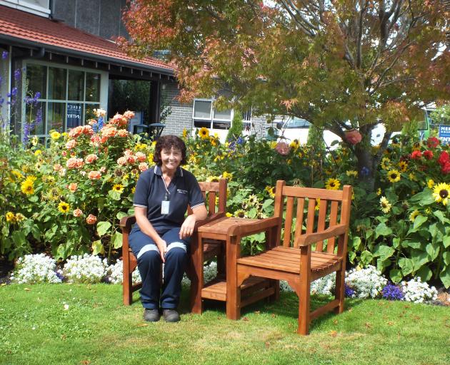 The only permanent gardener at Mercy Hospital, Emma Paul takes a seat, a rare occurrence during...