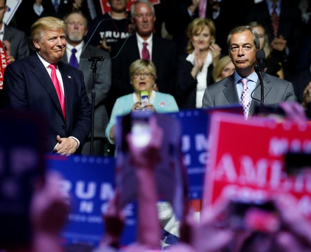 Donald Trump (left) with Nigel Farage at the campaign rally in Mississippi. Photo: Reuters 