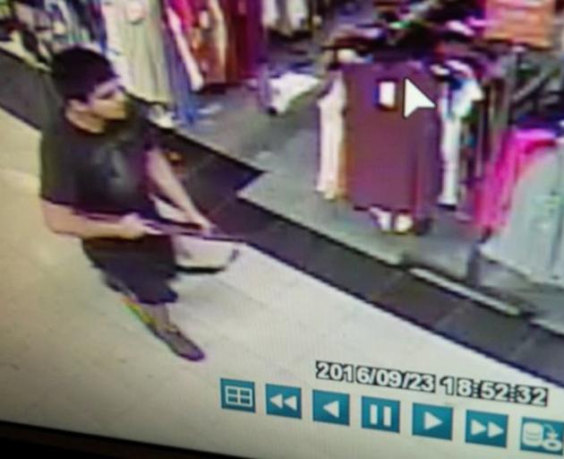 Security footage of the gunman in the store. Four women and a man were killed. Photo: Reuters 