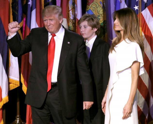 Donald Trump with wife Melania and his son Baron at his election night rally in New York. Photo: Reuters 