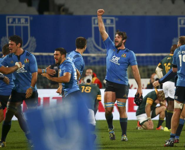 The Italians celebrate their first win over South Africa. Photo: Reuters 