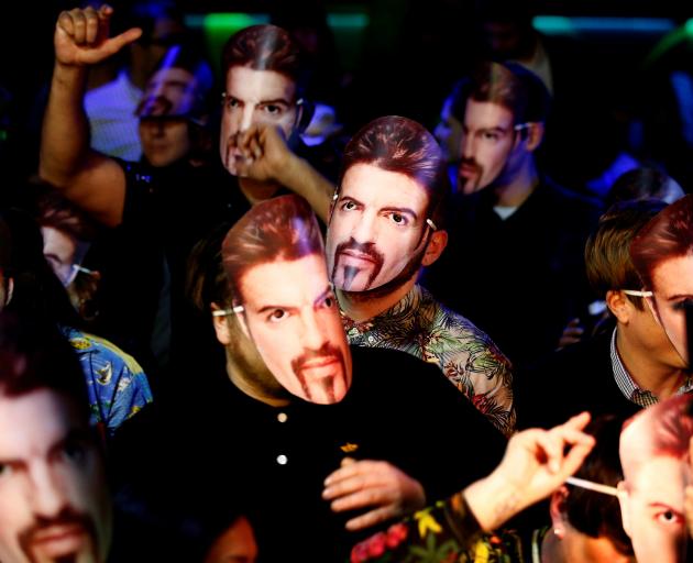 Fans wore George Michael masks at the event in Soho. Photo: Reuters 
