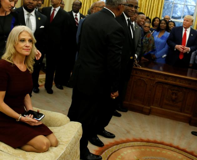 A relaxed Kellyanne Conway (left) in the Oval Office. Photo: Reuters 