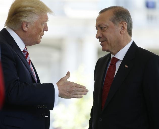 President Donald Trump greets Turkish leader Recep Tayyip Erdogan at the White House. Photo:...