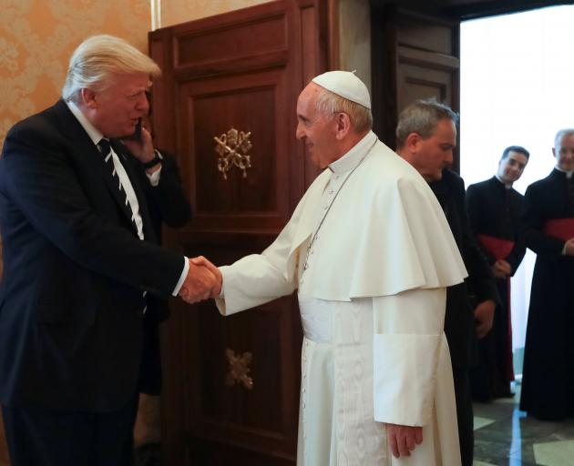 Pope Francis greet Donald Trump at the Vatican. Photo: Reuters 