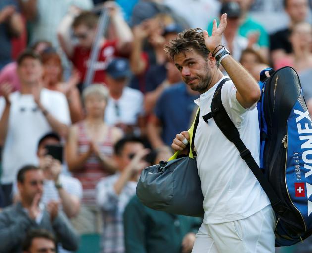 Stan Wawrinka acknowledges the crowd after losing in the first round on Monday. Photo: Reuters 