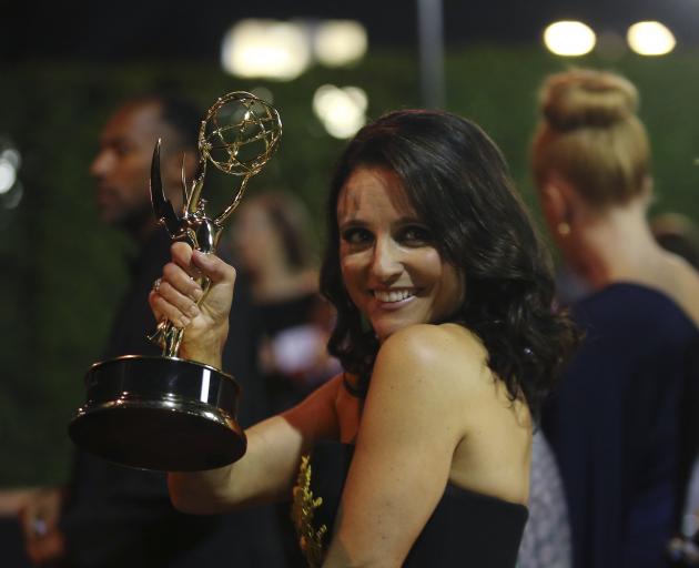 Julia Louis Dreyfus with her sixth consecutive Emmy for Veep. Photo: Reuters