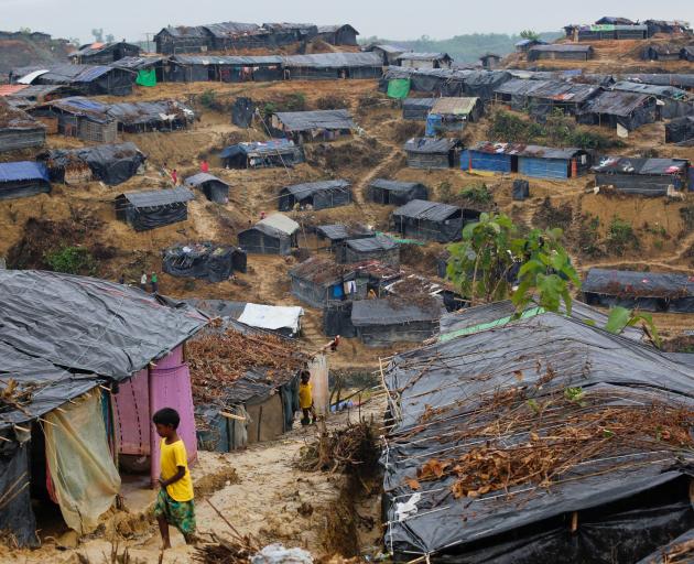 Rohingya refugees outside temporary shelters at a camp in Cox's Bazar, Bangladesh. Photo: Reuters 