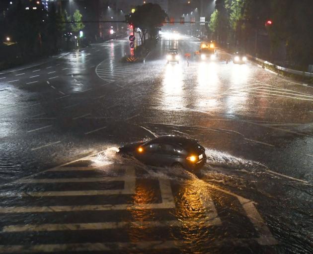 A waterlogged road in in Nagoya. Photo: Kyodo via Reuters 