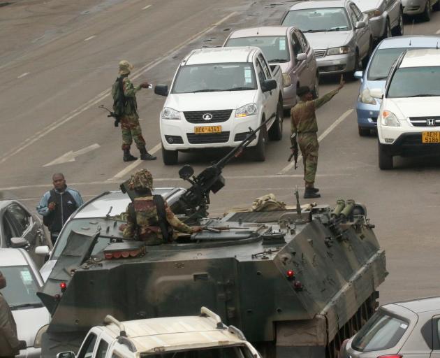 Military vehicles and soldiers patrol the streets in Harare on Wednesday. Photo: Reuters 