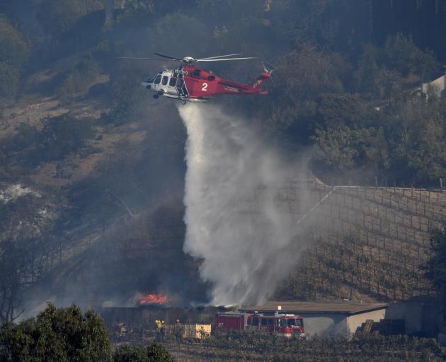 A building burns on Rupert Murdoch's vineyard. Photo: Reuters 