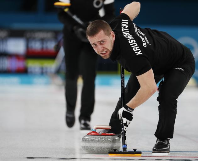 Alexander Krushelnitsky won bronze with his wife Anastasia Bryzgalova in mixed-doubles curling. Photo: Reuters