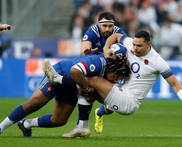 England’s Ben Te'o is tackled by France’s Mathieu Bastareaud. Photo: Reuters 