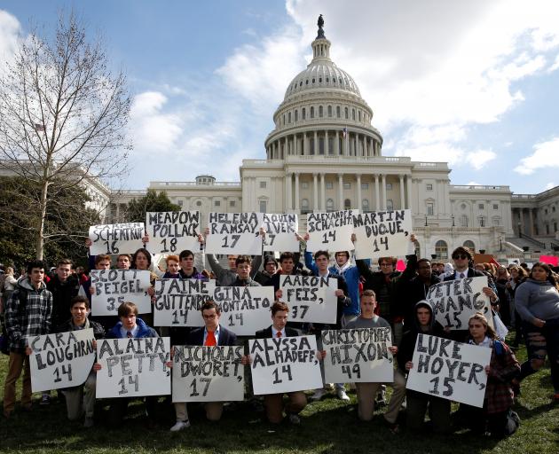 In Washington, protesters held placards with the names of the victims of those killed in the...