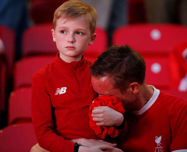 Unhappy Liverpool fans. Photo: Reuters 