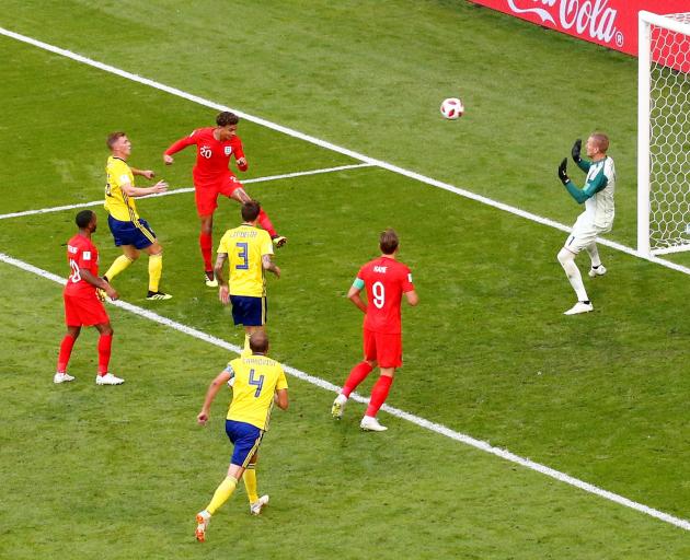 Dele Alli puts the second goal in the net for England. Photo: Reuters 