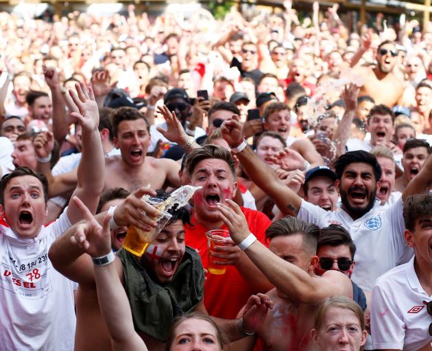 England fans celebrate the victory in London. Photo: Reuters 