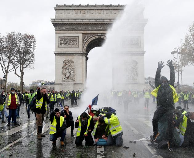 Protesters clashed with police at the Place de l'Etoile near the Arc de Triomphe. Photo: Reuters 