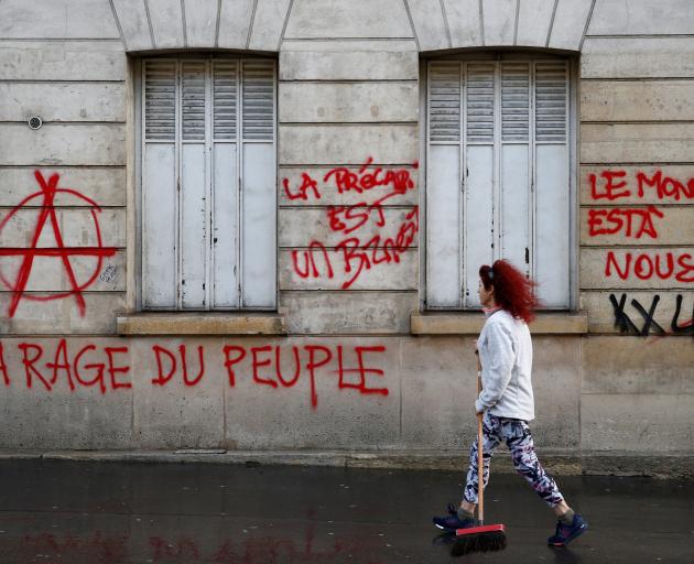 Graffiti written on the facade of a building in Paris. Photo: Reuters 