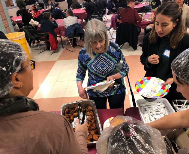 Furloughed government workers, contractors and their families attended a free community dinner...