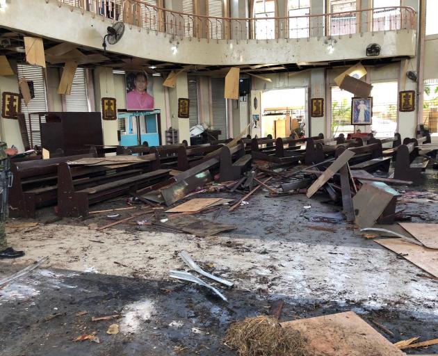 The first explosion went off inside the cathedral on Jolo island, in Sulu province, and was...