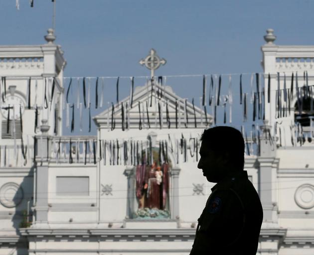 A security guard outside St Anthony's, one of the churches attacked. Photo: Reuters 