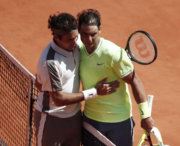 Switzerland's Roger Federer congratulates Rafael Nadal. Photo: Reuters