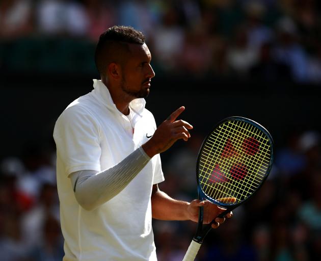 Nick Kyrgios kept up a running dialogue with the umpire, which earned him a warning. Photo: Reuters