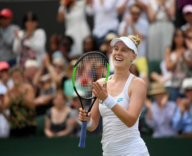 Alison Riske celebrates winning her fourth round match against Ashleigh Barty. Photo: Reuters