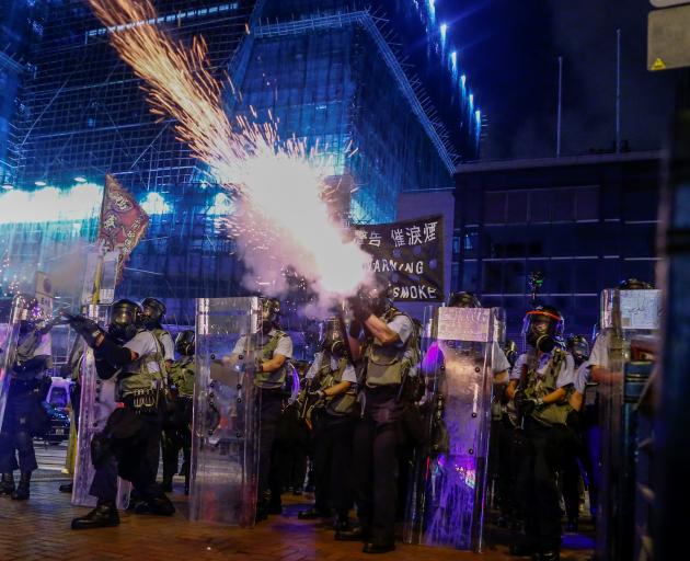 Police fire tear gas at anti-extradition bill protesters during clashes in Sham Shui Po. Photo:...