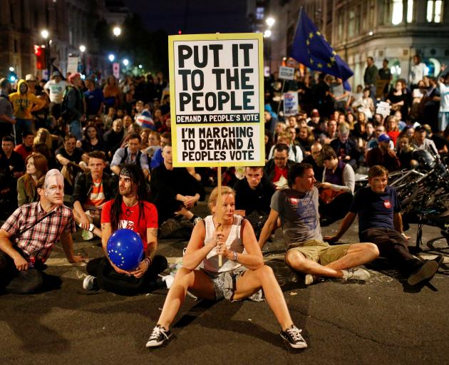 Anti-Brexit protesters were still outside the Houses of Parliament in London late on Wednesday....