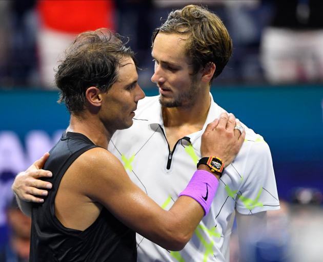 Daniil Medvedev (right) congratulates Rafael Nadal after a match that took nearly five hours....