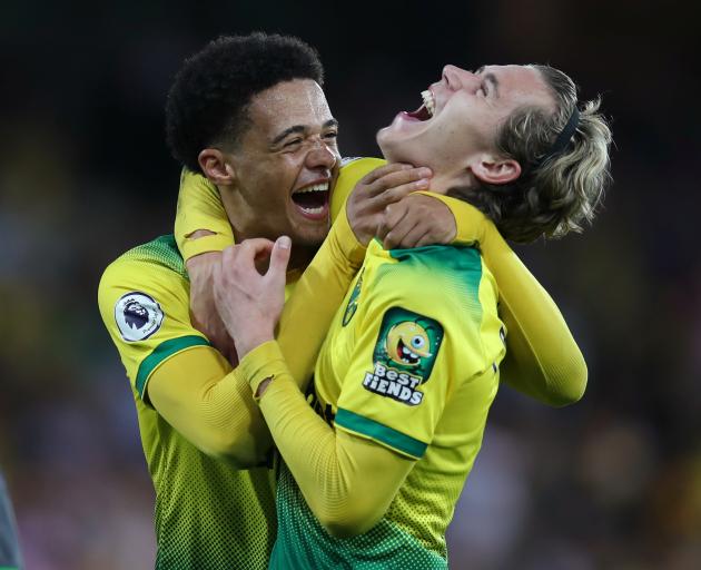 Norwich City's Jamal Lewis and Todd Cantwell celebrate beating Manchester City. Photo: Reuters 