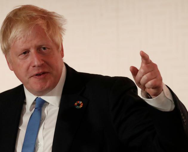 Britain's Prime Minister Boris Johnson says he's still cautiously optimistic about reaching a...